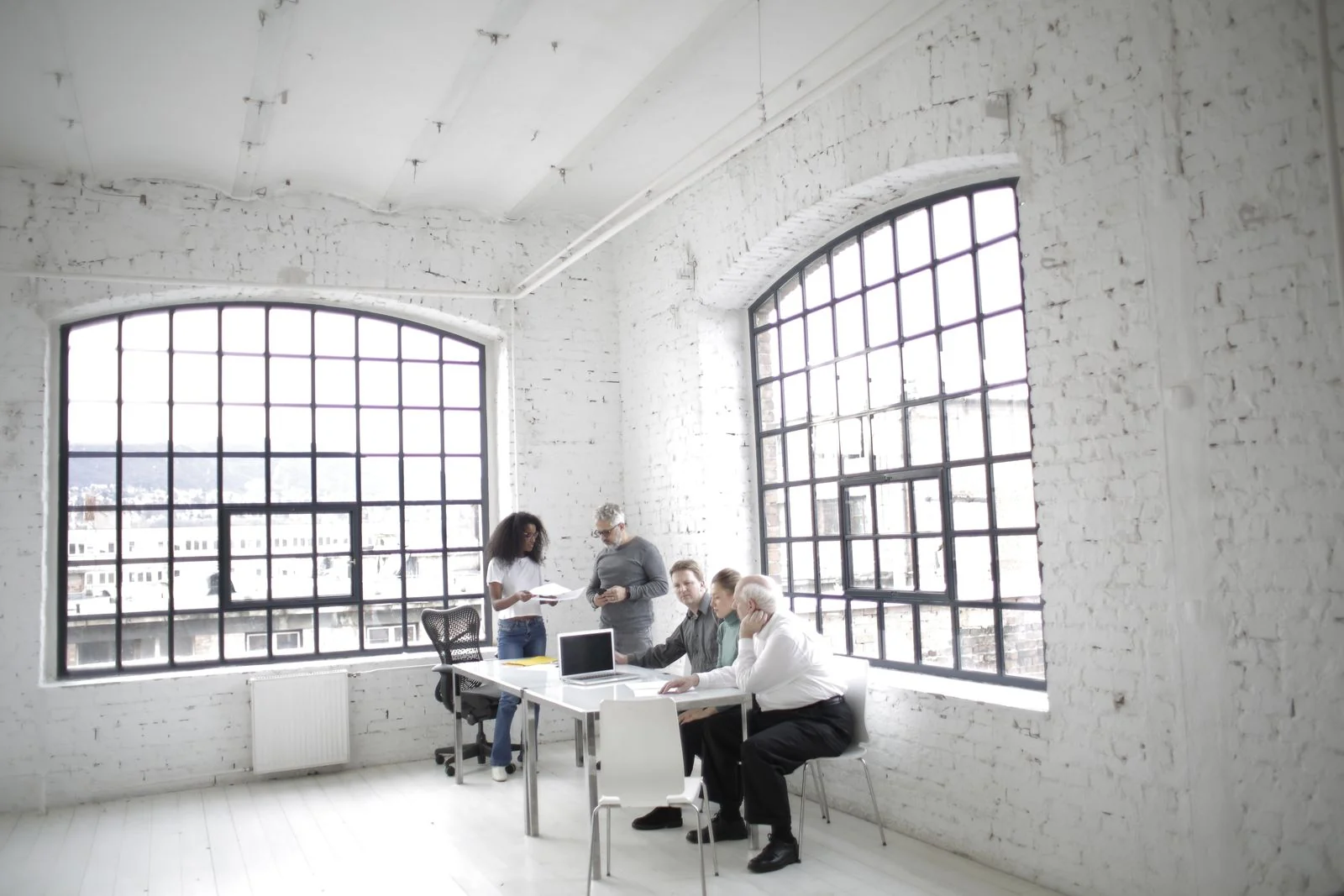 Professionals discussing a business approach in a bright workspace